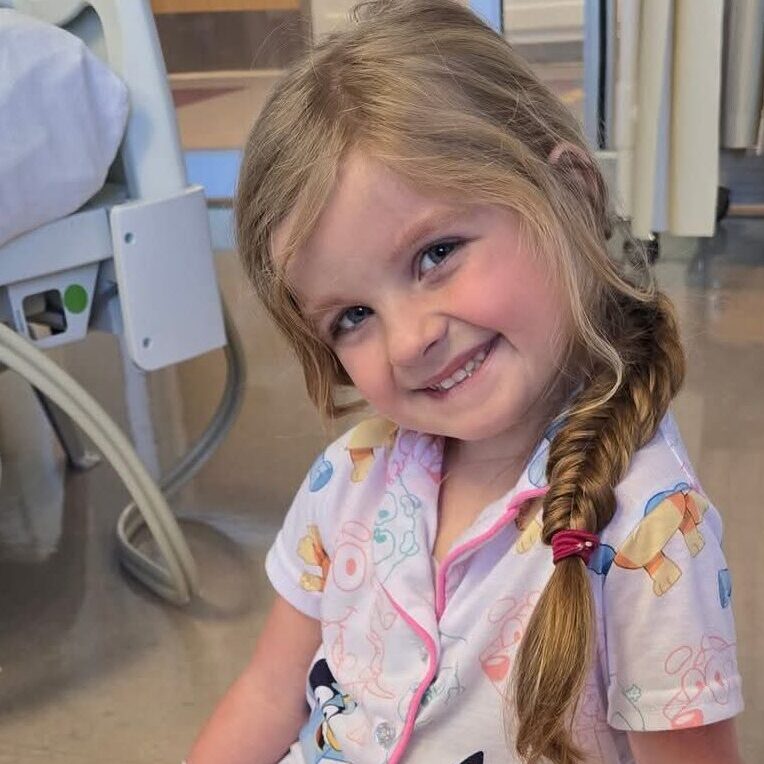 Evelyn playing with toys in the hospital