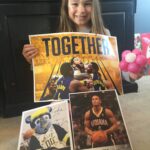 Lydia after meeting some Pacers and dancing with boomer at Kroger