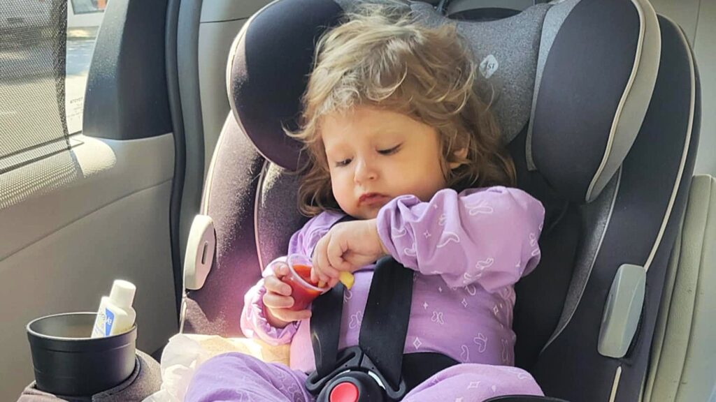 Little girl eating fries and ketchup