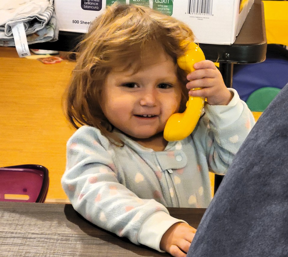 Little girl calling on play phone